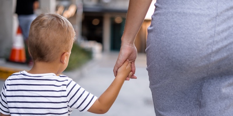 little-boy-holding-hand-with-mother