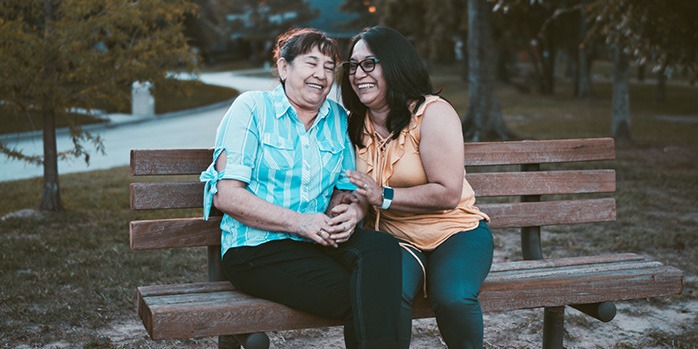 two-women-on-bench-laughing